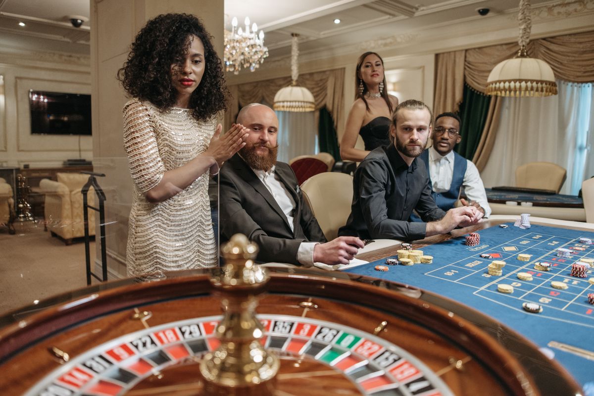 Dealer shuffling cards at the casino table